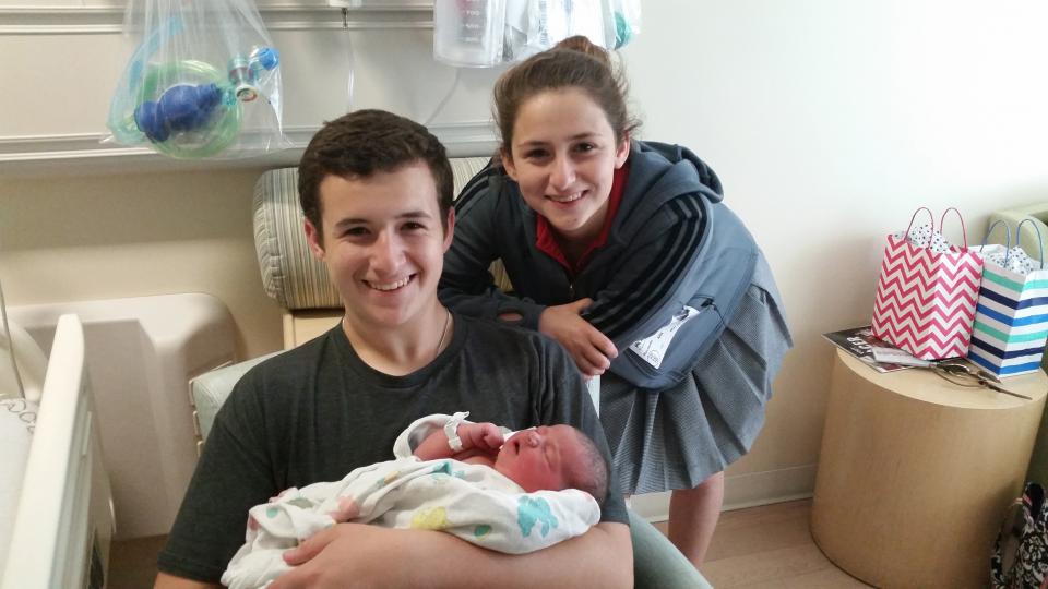 Swimming sophomore Rochelle Mudd and her brother Jacob Mudd (Jesuit ‘15), who plays rugby, with their new cousin Catherine.