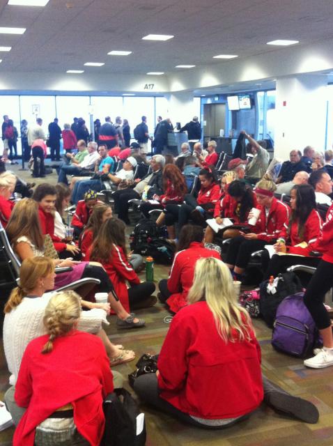 The St. Francis cross country team sits in the Sacramento Airport Friday before flight was canceled.