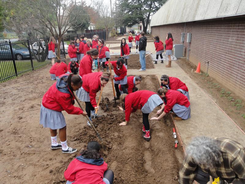 Students creating the garden.