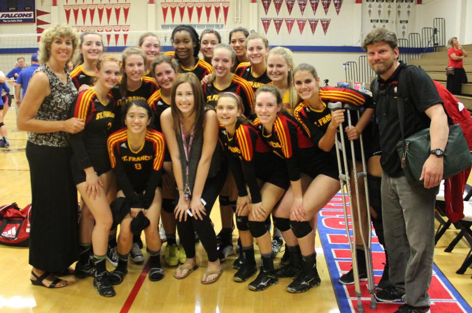Natalie Woodruff with Troubadour teammates at the Holy Court match against Christian Brothers on Sept. 3.